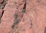 Hole-in-the-Rock -- Uncle Ben's Dugway.  Near the bottom of the crevice, the pioneers tacked their road onto the steep slope of the crevice wall. The original road was wider than is seen here as much of the built-up rock fill has eroded away. The steps in the upper portion of the image were cut by miners in 1899 and are unrelated to the pioneer roadwork. Lamont Crabtree Photo